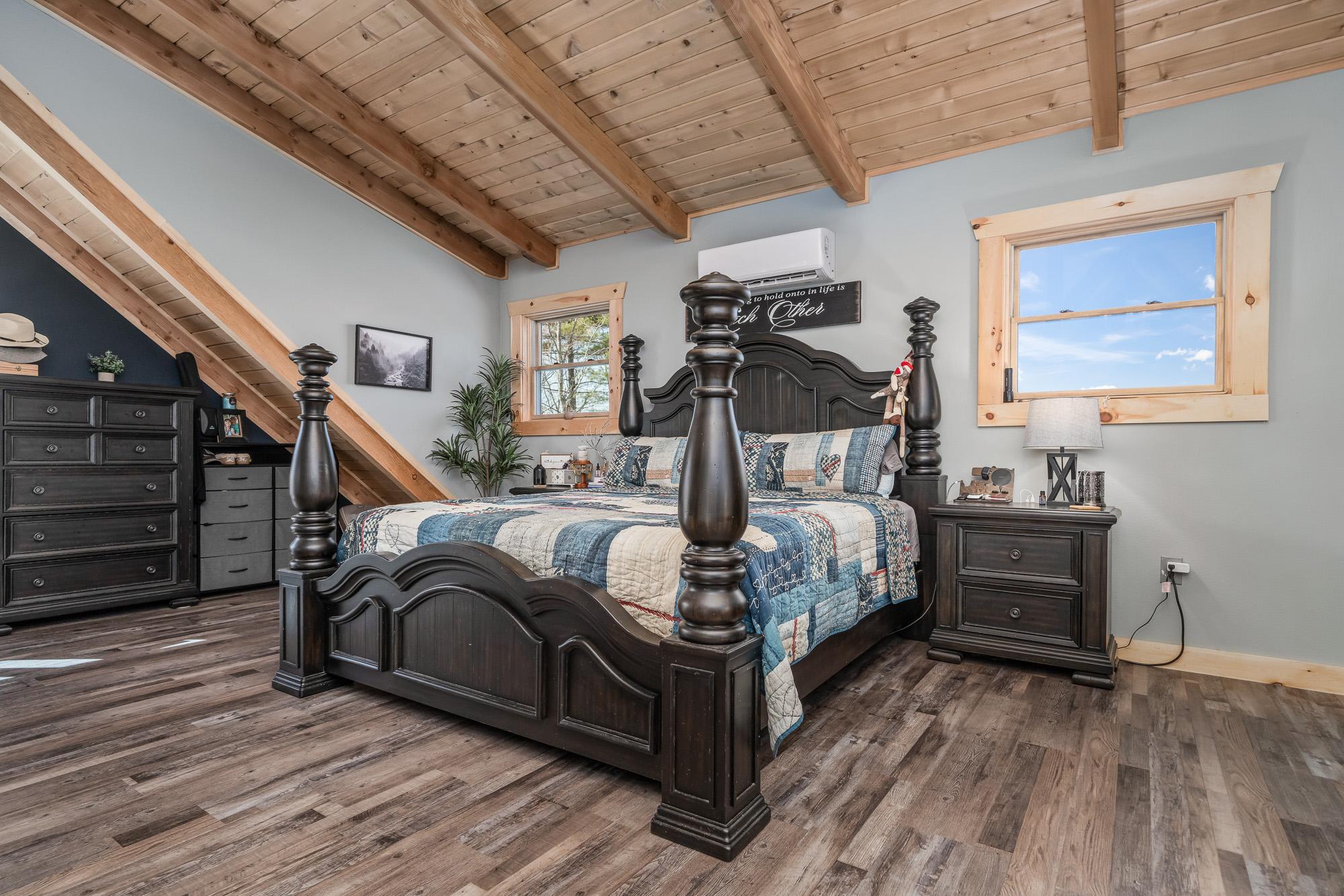 Matthews Log Home Bedroom with Timber Ceiling